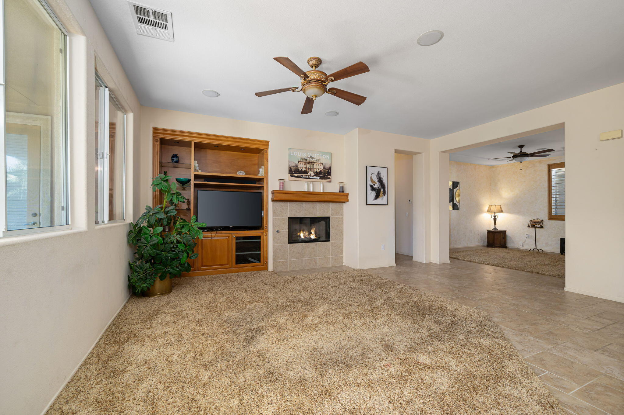 83399 Wagon Road Indio, CA 92203 - Photo 27 of 48 a view of a livingroom with a ceiling fan and window
