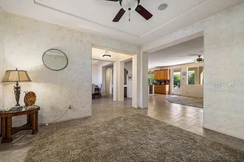 a livingroom with workspace and a window