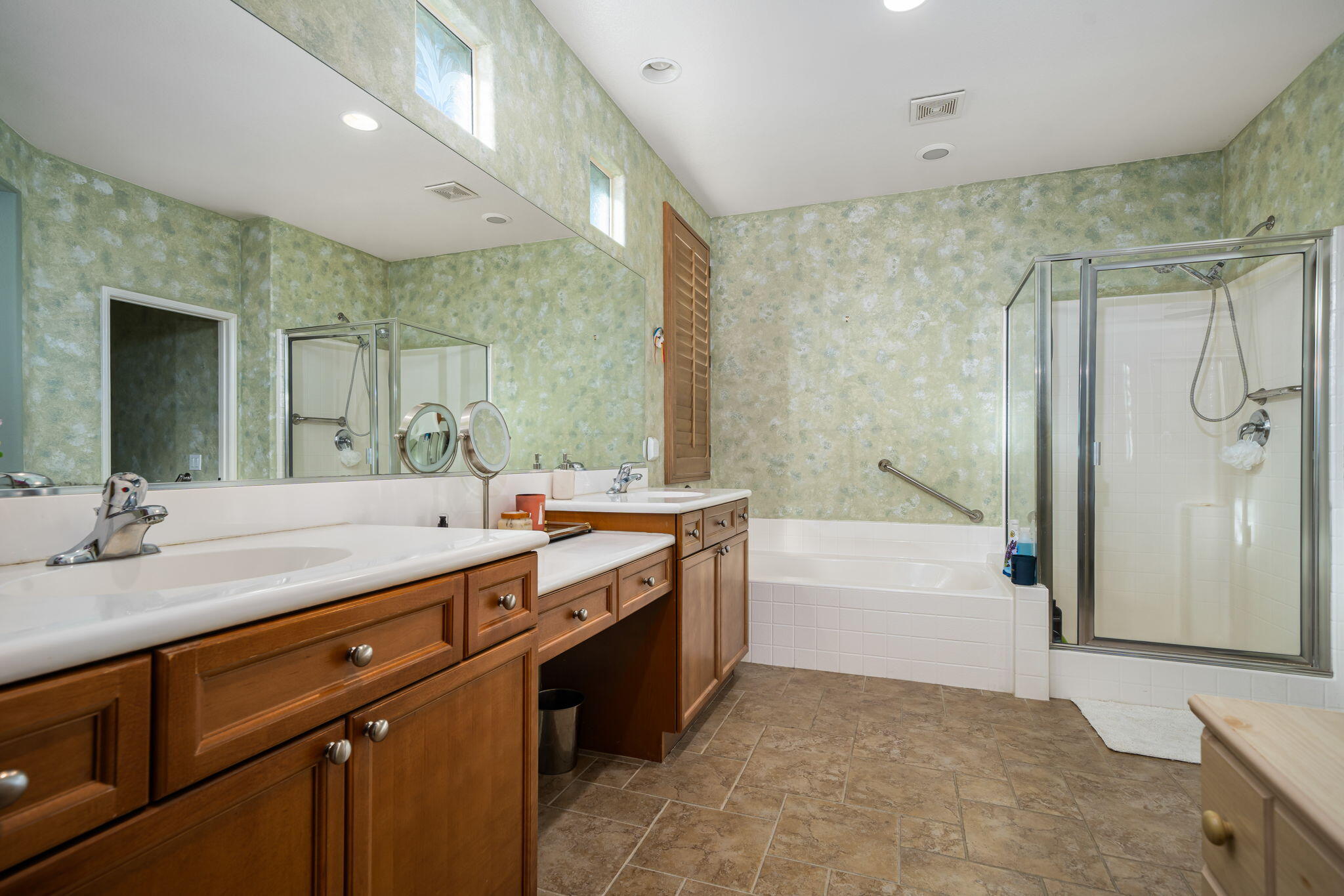83399 Wagon Road Indio, CA 92203 - Photo 34 of 48 a spacious bathroom with a tub sink shower and mirror