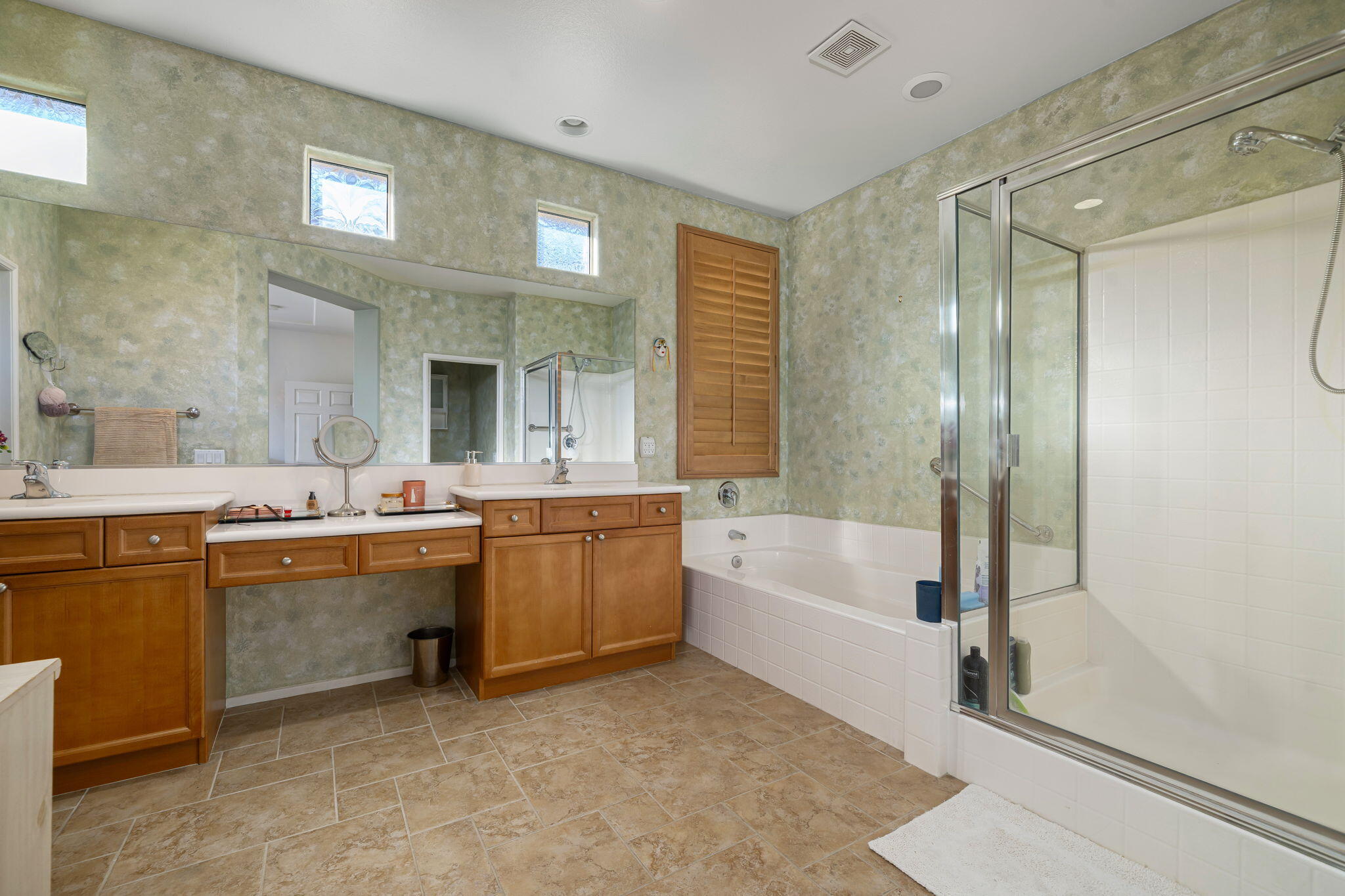 83399 Wagon Road Indio, CA 92203 - Photo 35 of 48 a bathroom with a tub a sink shower and mirror