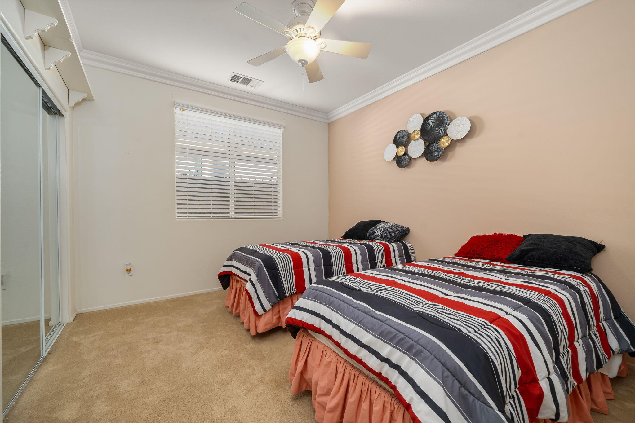 83399 Wagon Road Indio, CA 92203 - Photo 37 of 48 a bedroom with two beds and a chandelier