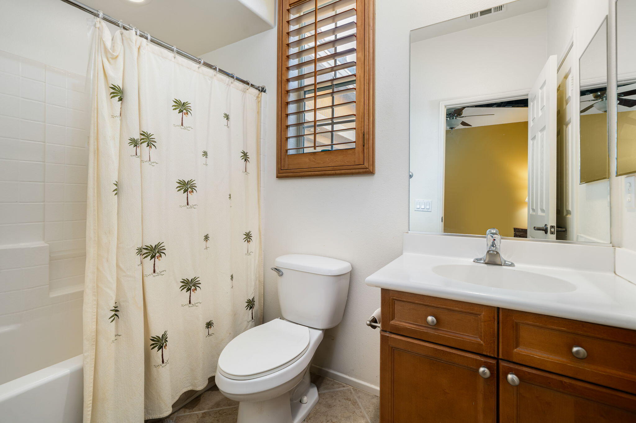 83399 Wagon Road Indio, CA 92203 - Photo 45 of 48 a bathroom with a granite countertop toilet a sink and a mirror