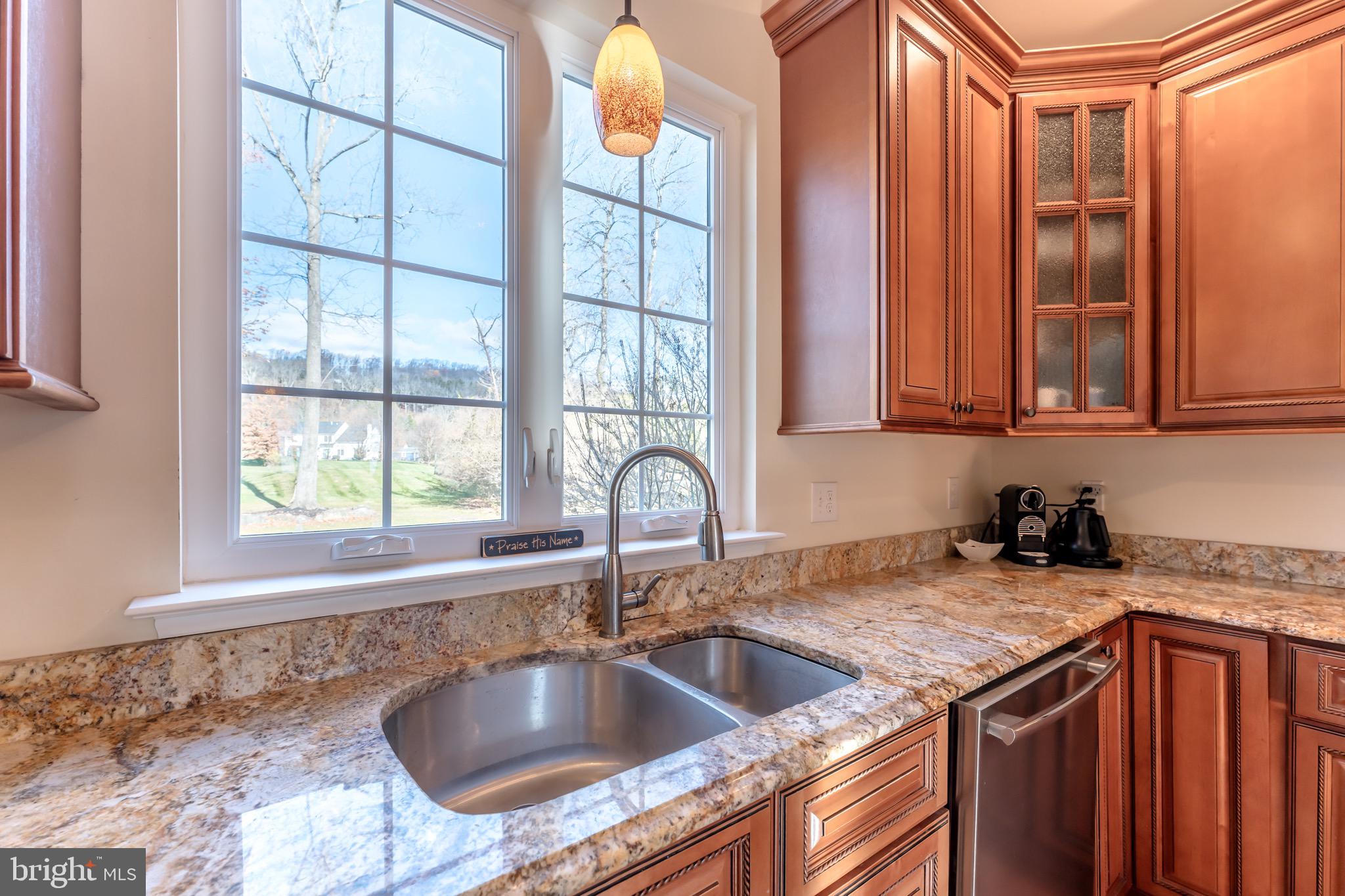 3505 Woodbyne Road Hellertown, PA 18055 - Photo 17 of 78 a kitchen with granite countertop a sink and a counter top space