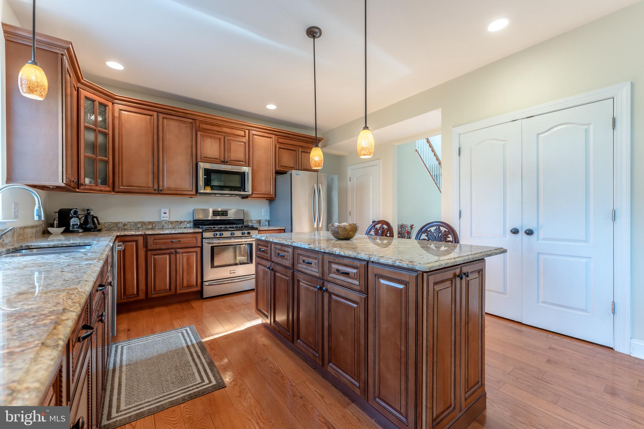 3505 Woodbyne Road Hellertown, PA 18055 - Photo 18 of 78 a kitchen with stainless steel appliances granite countertop a stove a sink and a refrigerator