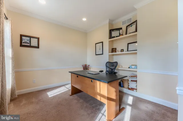a bathroom with a bathtub and a flat tv screen