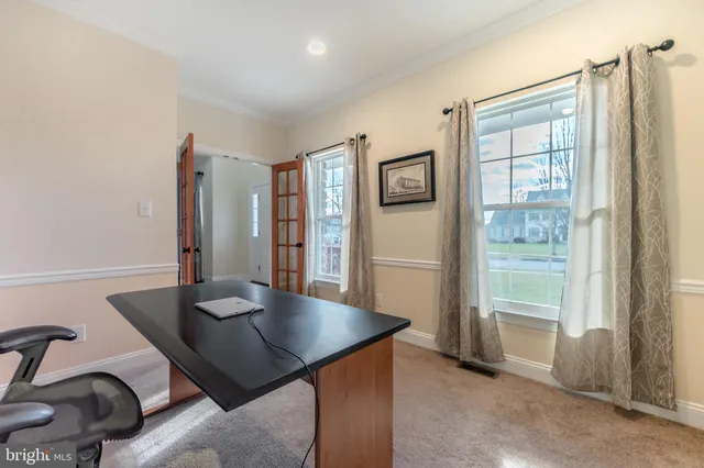 a spacious bedroom with a bed and a table