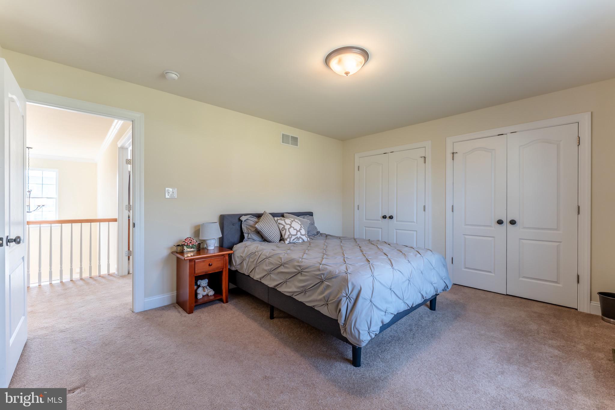 3505 Woodbyne Road Hellertown, PA 18055 - Photo 41 of 78 a spacious bedroom with a bed and a table