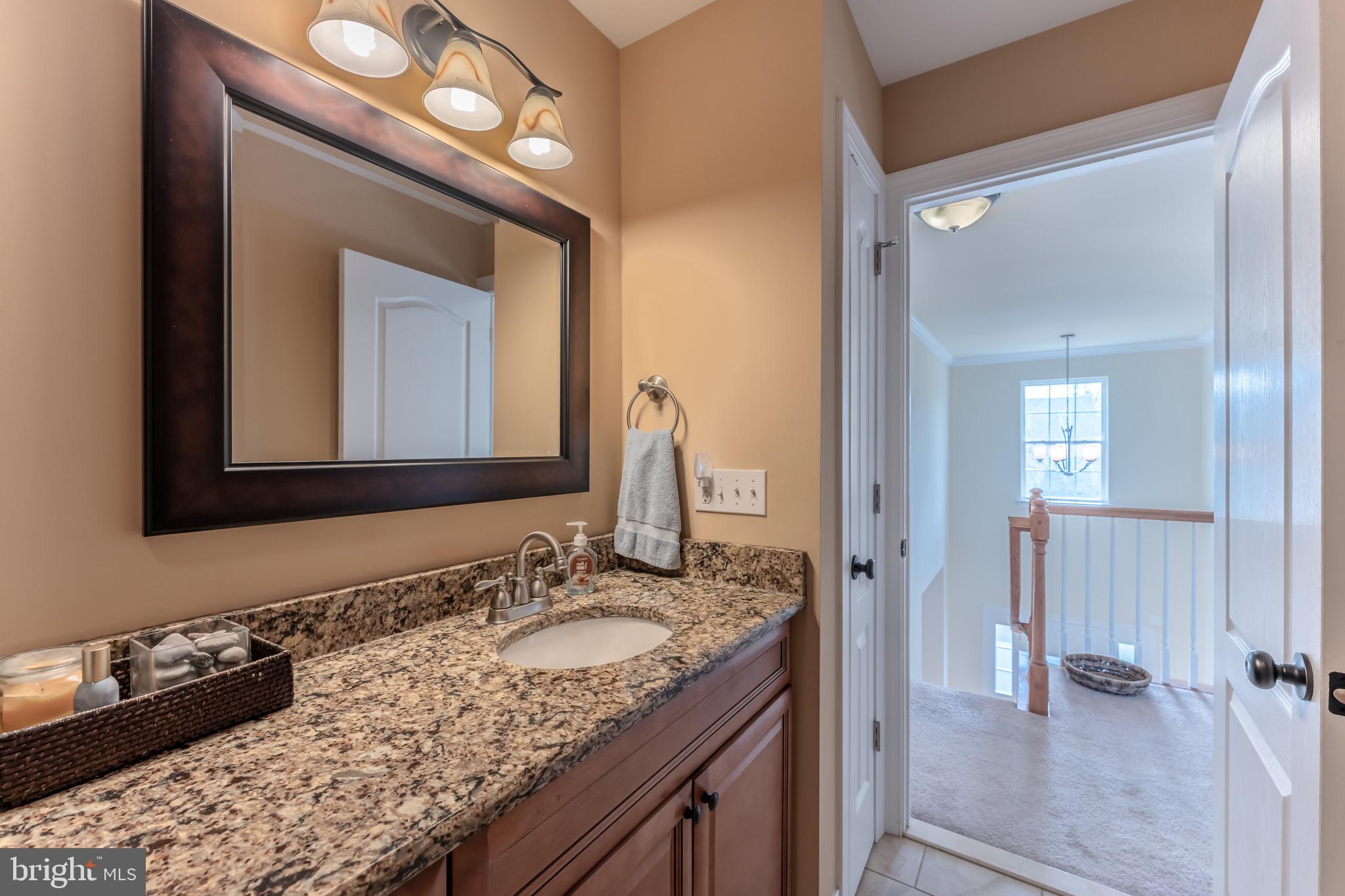 3505 Woodbyne Road Hellertown, PA 18055 - Photo 43 of 78 a bathroom with a sink vanity granite and a mirror