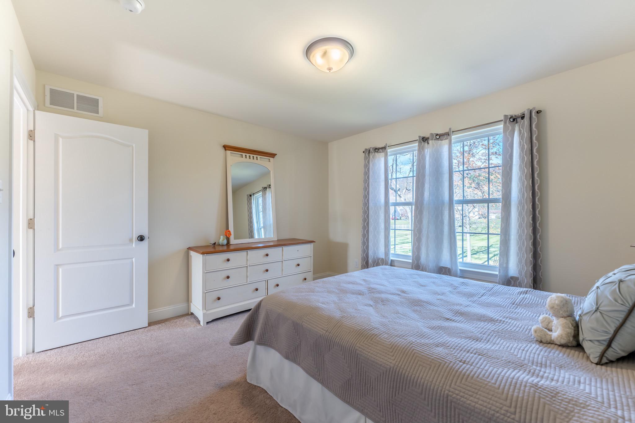 3505 Woodbyne Road Hellertown, PA 18055 - Photo 47 of 78 a bedroom with a bed and a window