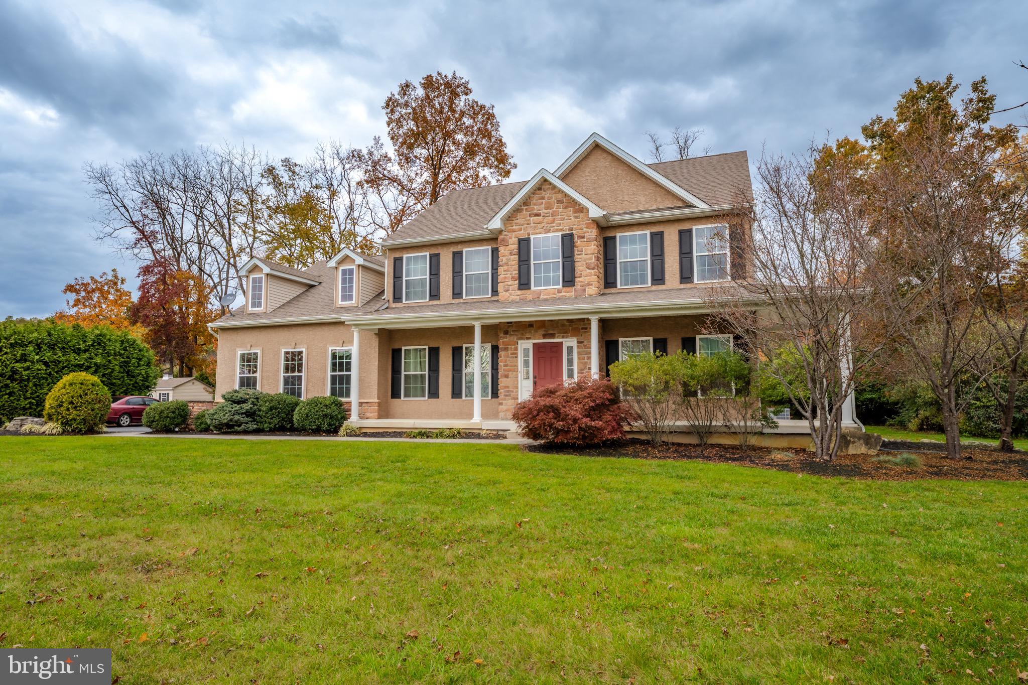 3505 Woodbyne Road Hellertown, PA 18055 - Photo 5 of 78 a front view of a house with a yard