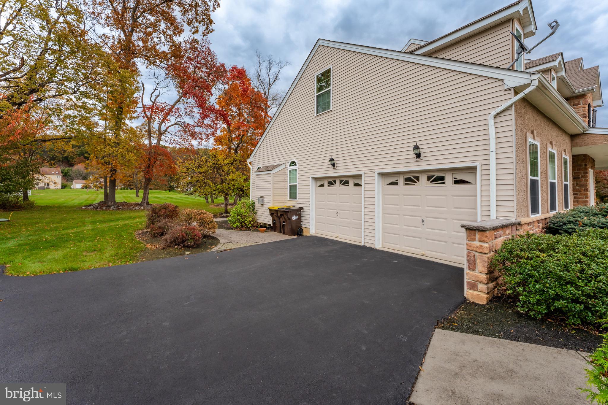 3505 Woodbyne Road Hellertown, PA 18055 - Photo 51 of 78 a view of a house with a yard and garage