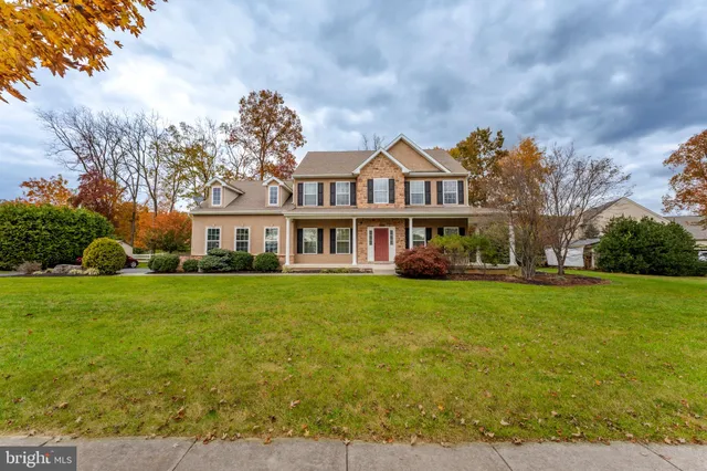 a living room with furniture a window and a table
