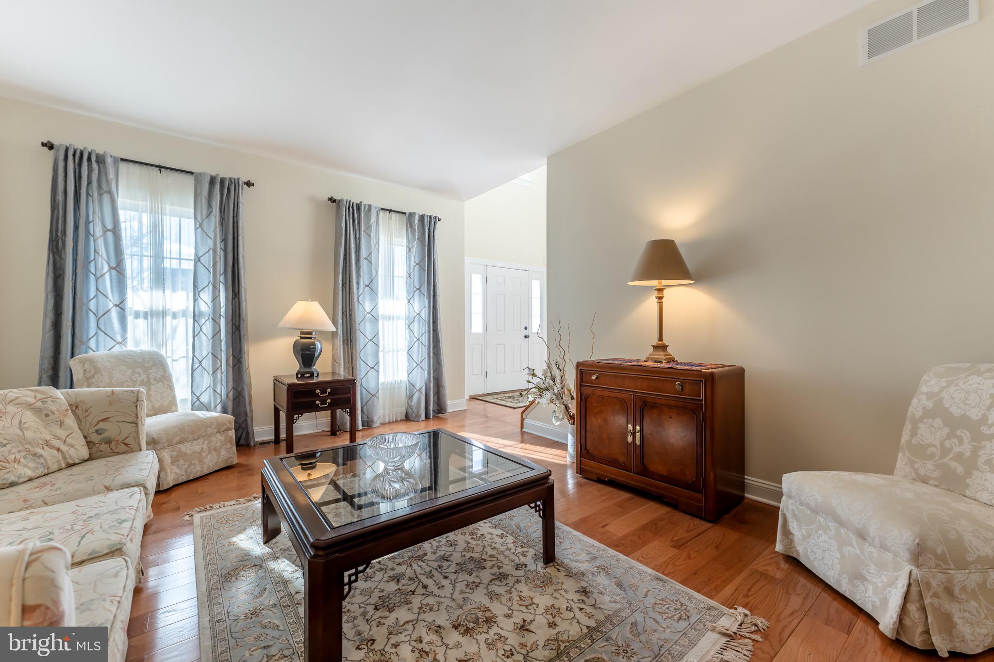 3505 Woodbyne Road Hellertown, PA 18055 - Photo 10 of 78 a living room with furniture a lamp and a window