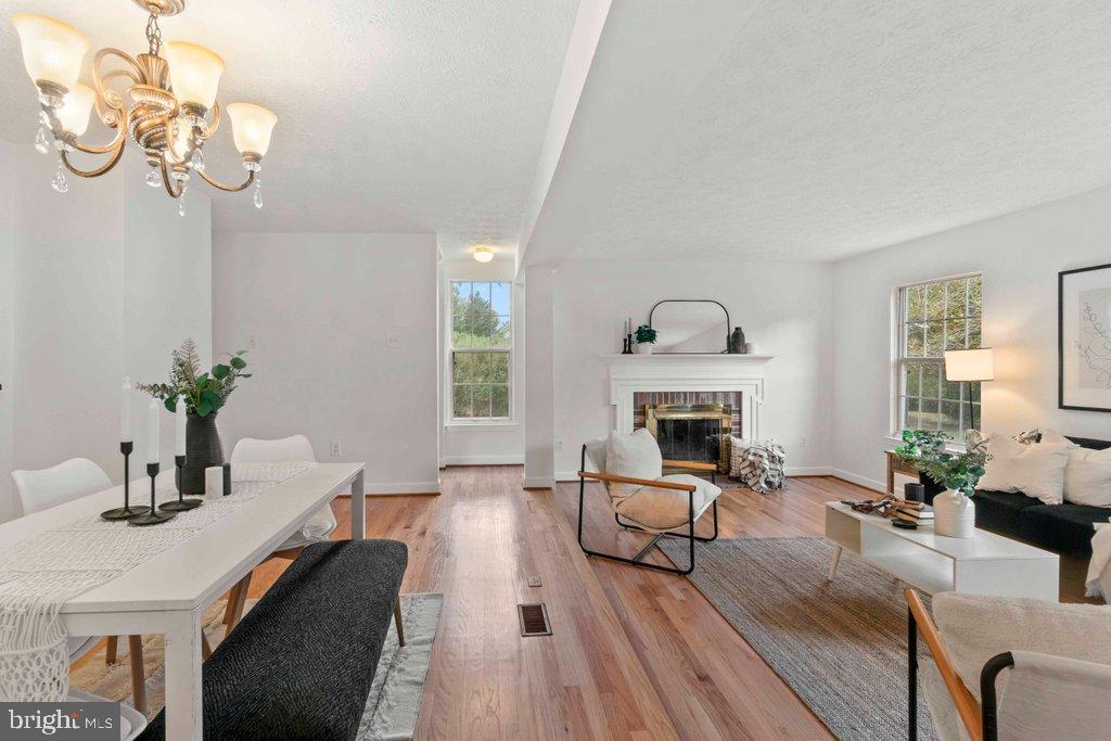 25 Capps Court Gaithersburg, MD 20878 - Photo 11 of 39 a living room with furniture and a fireplace