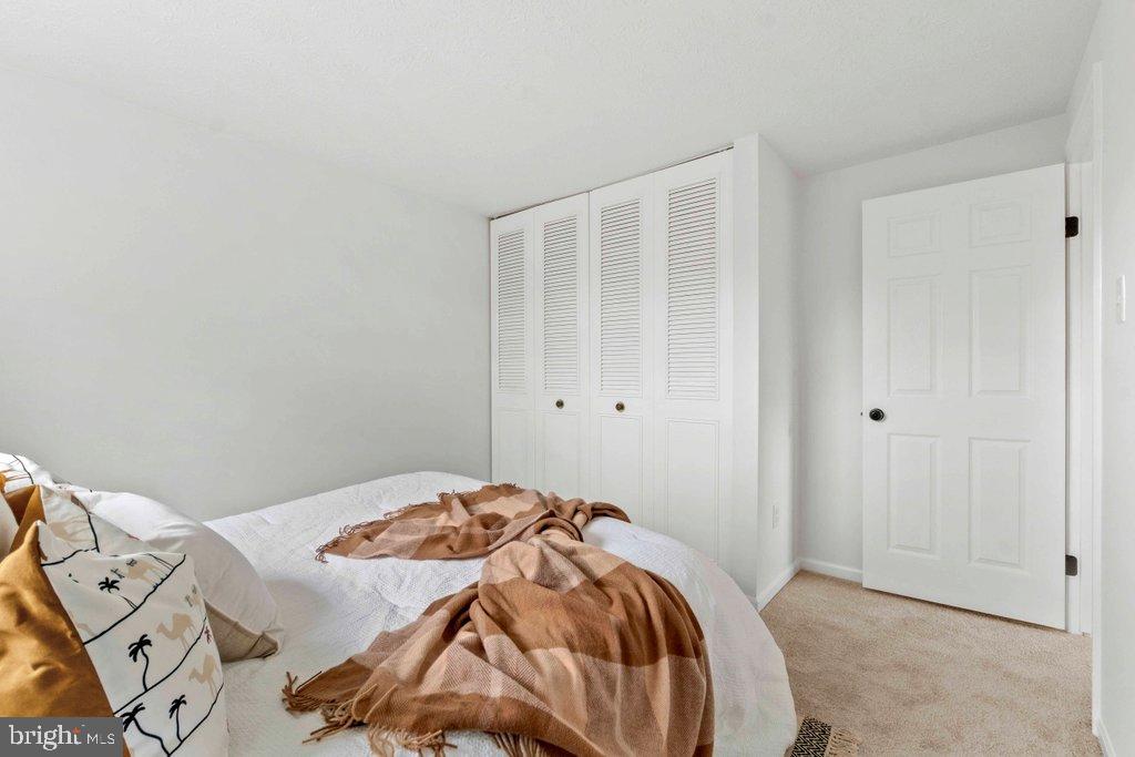 25 Capps Court Gaithersburg, MD 20878 - Photo 23 of 39 a bedroom with a bed and a tv