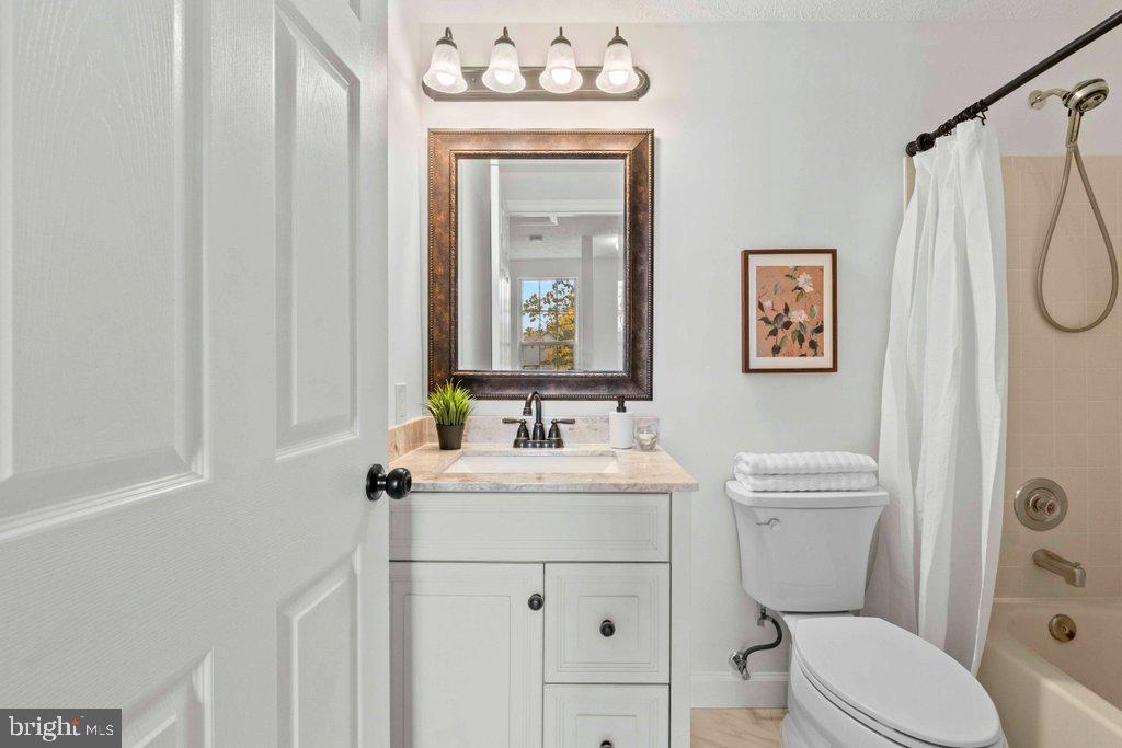 25 Capps Court Gaithersburg, MD 20878 - Photo 24 of 39 a bathroom with a sink a toilet and shower
