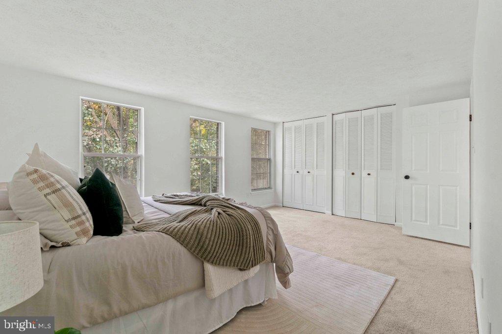 25 Capps Court Gaithersburg, MD 20878 - Photo 29 of 39 a spacious bedroom with two beds and a window