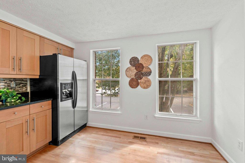 25 Capps Court Gaithersburg, MD 20878 - Photo 6 of 39 a view of a kitchen with a window fridge and front door