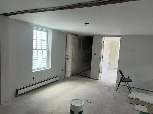 a view of an empty room with a window
