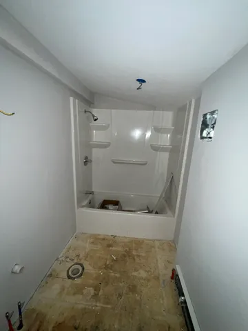 a bathroom with a sink and shower
