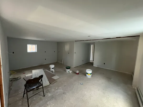 a room with lots of chairs and mirrors