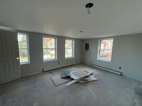 a view of an empty room with windows