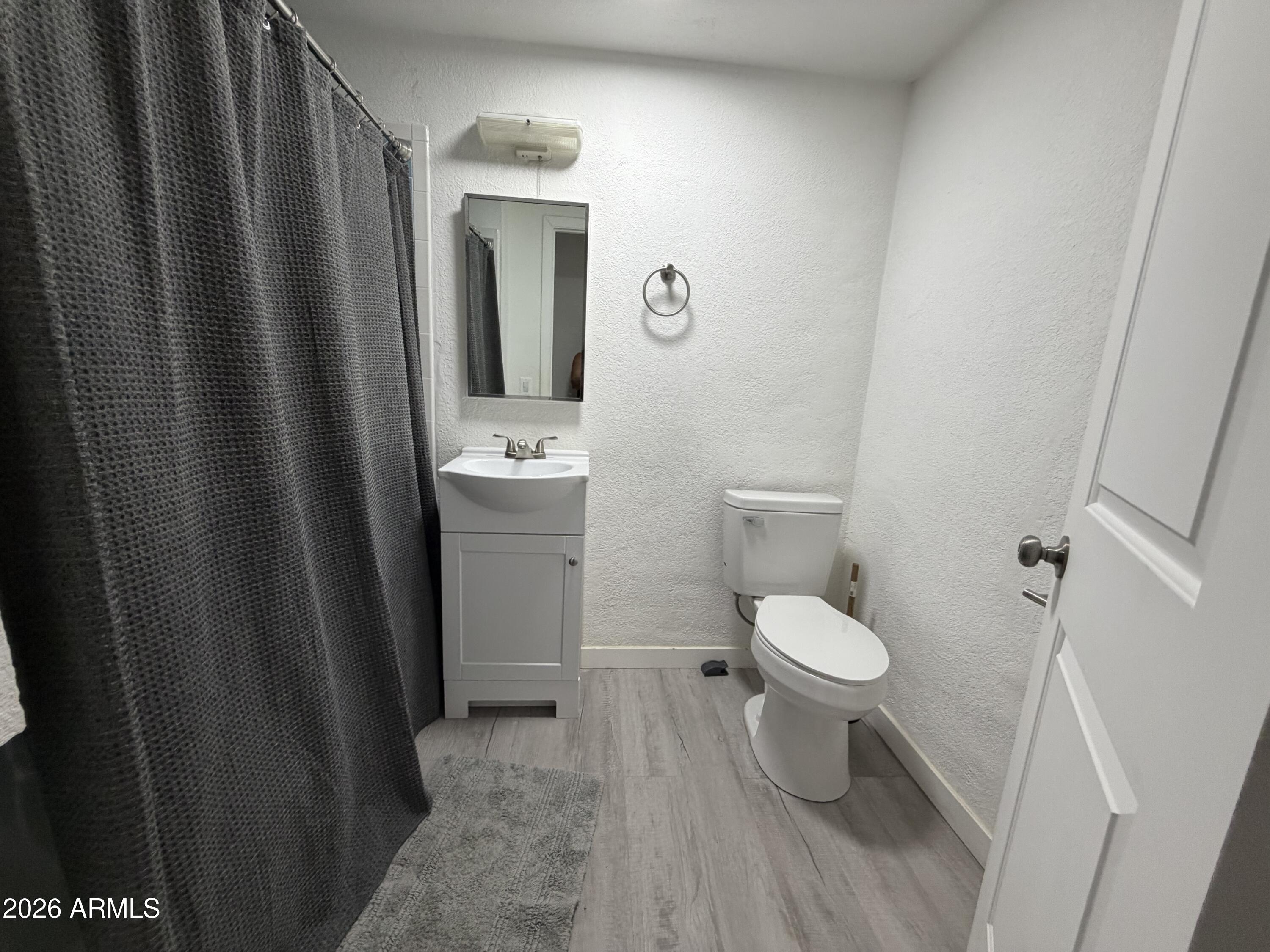 360 Pinal Street Globe, AZ 85501 - Photo 9 of 13 a bathroom with a toilet and a sink