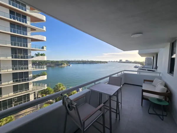 a terrace with outdoor seating and city view