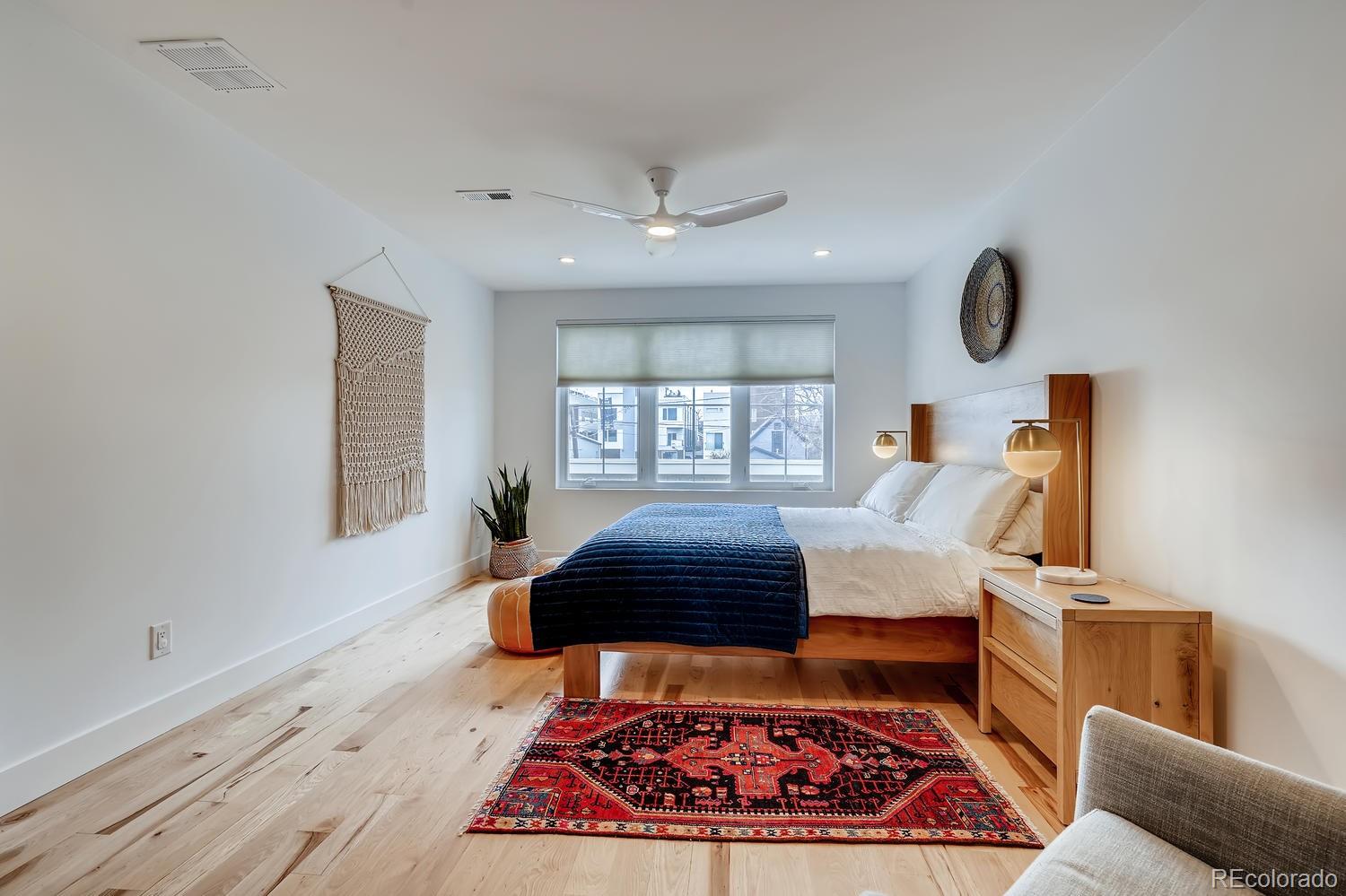 4565 Stuart Street Denver, CO 80212 - Photo 14 of 28 a living room with furniture and a rug
