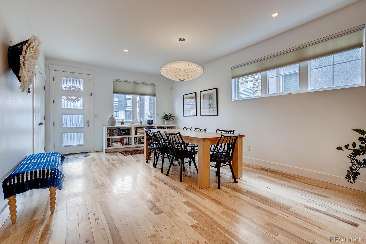 4565 Stuart Street Denver, CO 80212 - Photo 8 of 28 a view of a dining room with furniture and wooden floor