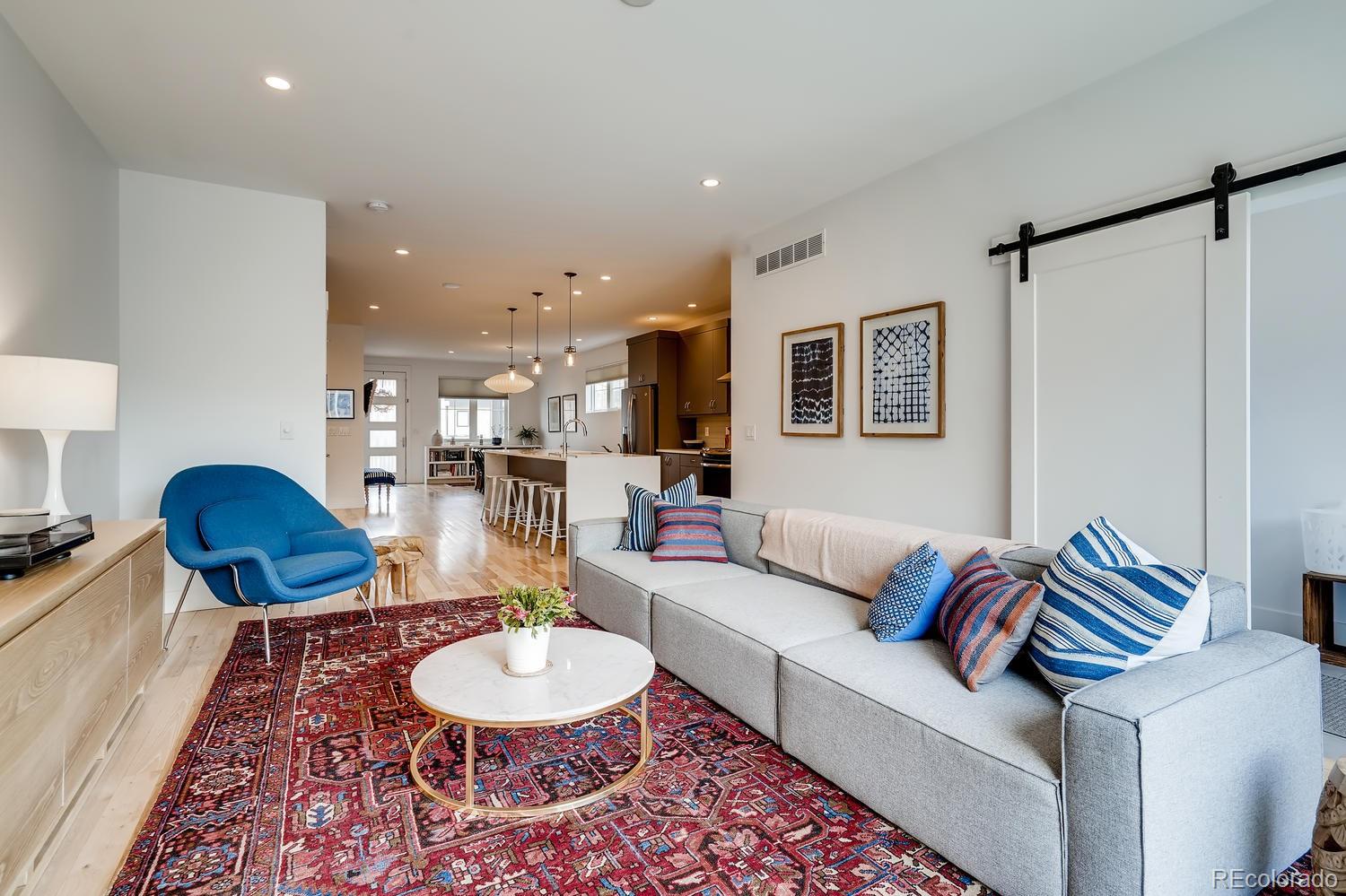 4565 Stuart Street Denver, CO 80212 - Photo 9 of 28 a living room with furniture and a table