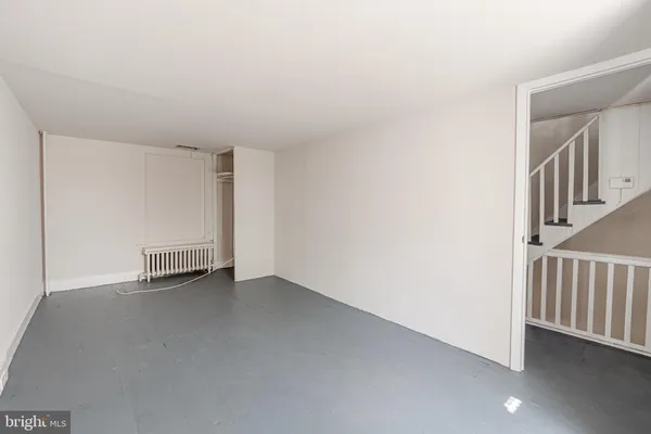 a view of an empty room with stairs