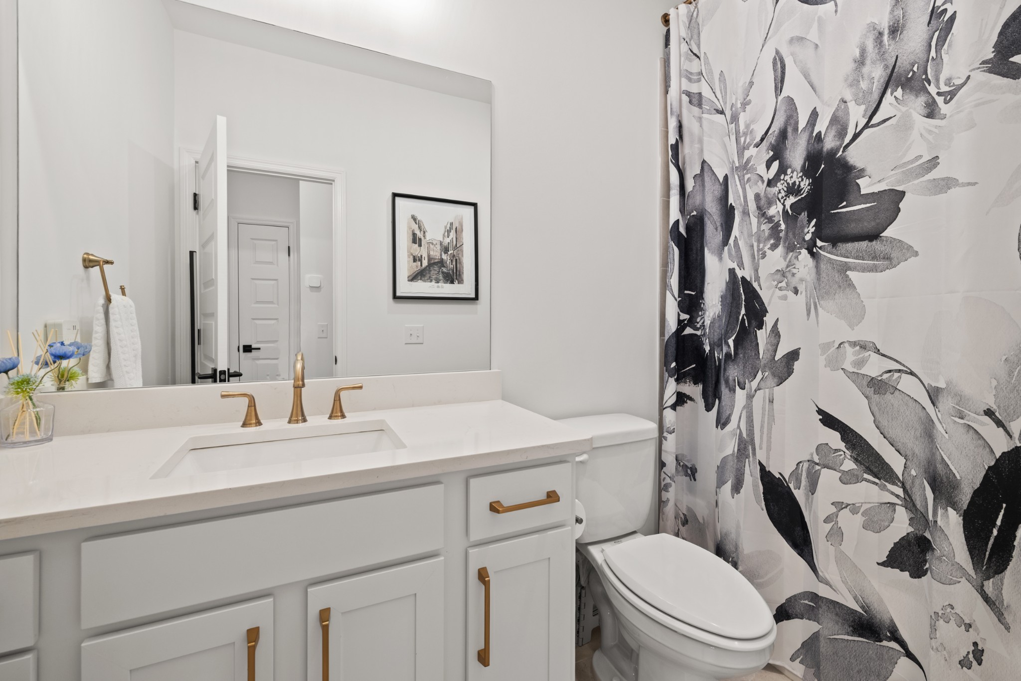 2104 Mackinac Bend Gallatin, TN 37066 - Photo 18 of 23 a bathroom with a sink a toilet and a mirror