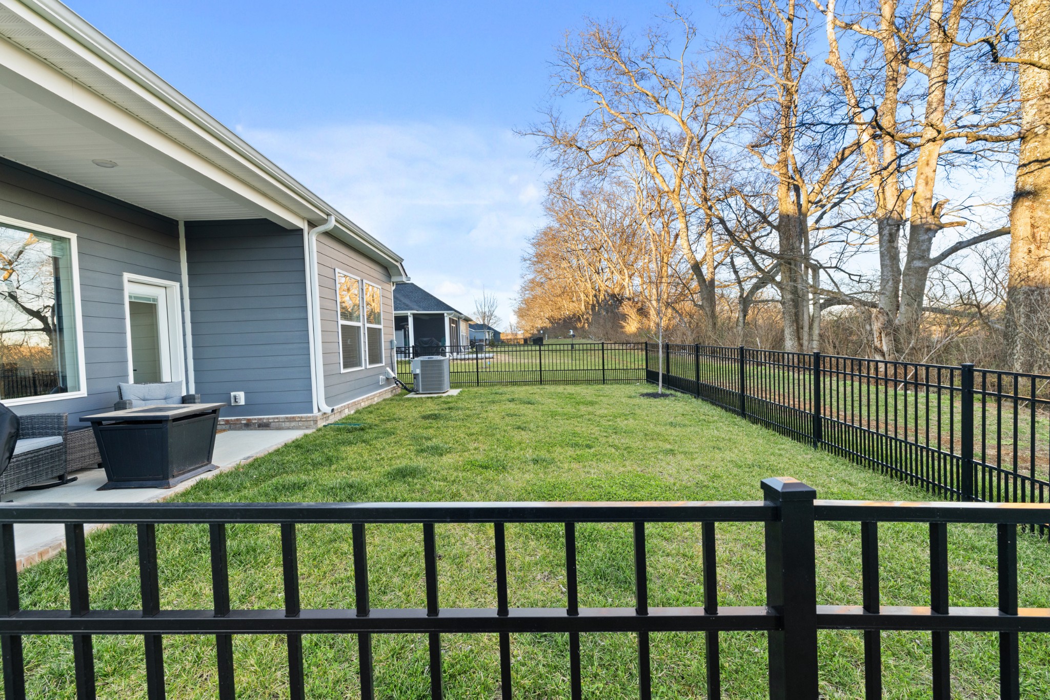 2104 Mackinac Bend Gallatin, TN 37066 - Photo 20 of 23 a view of a backyard with a large tree