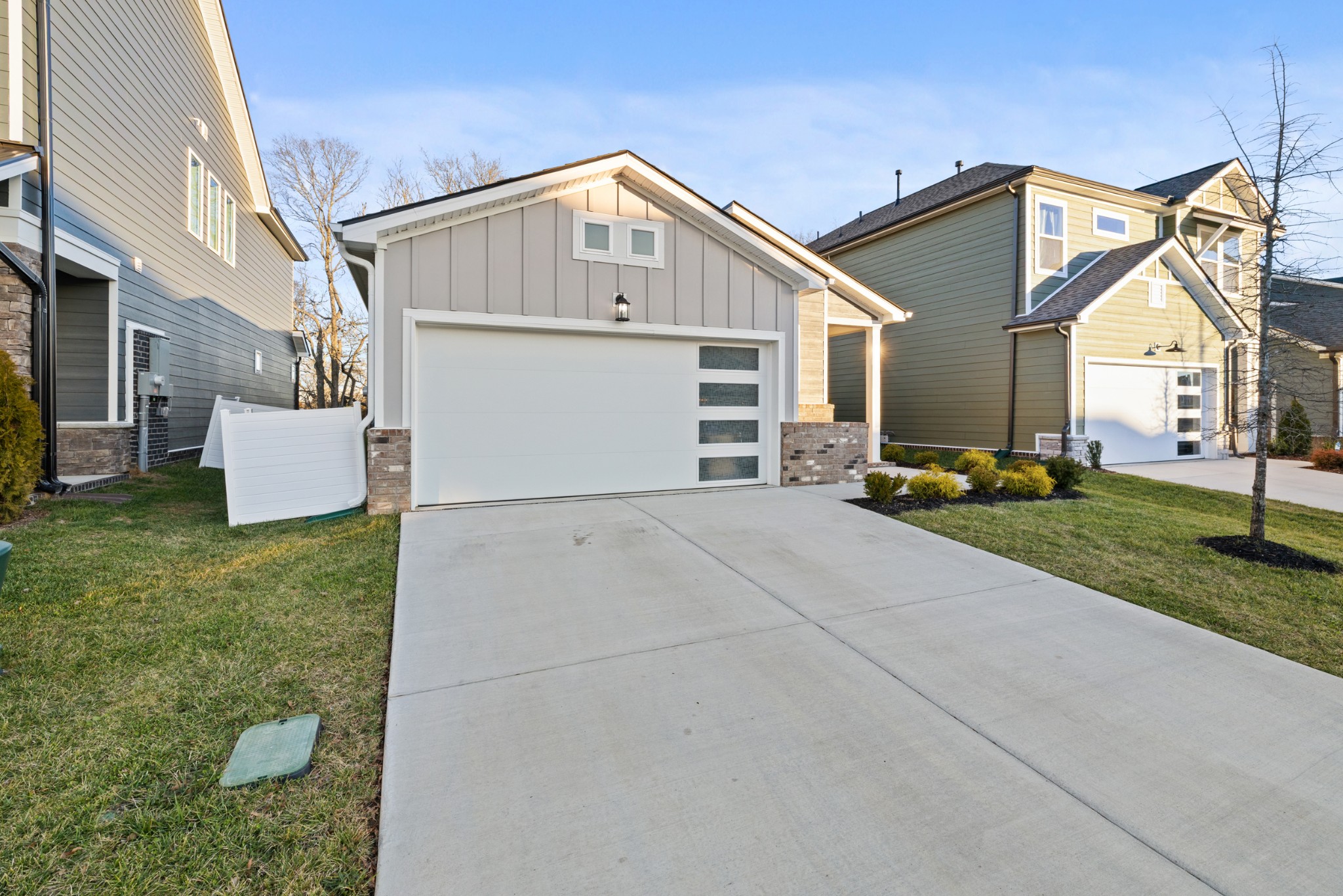 2104 Mackinac Bend Gallatin, TN 37066 - Photo 2 of 23 a front view of a house with a yard and garage
