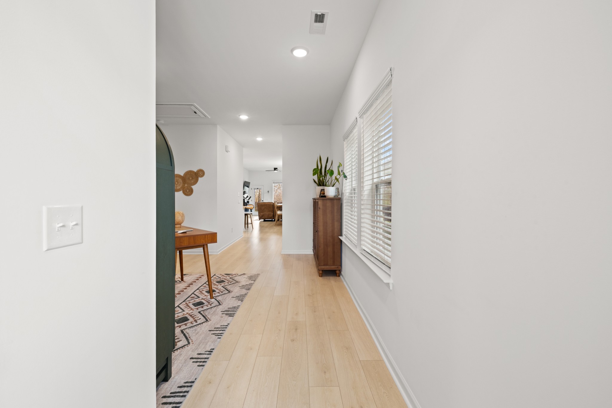 2104 Mackinac Bend Gallatin, TN 37066 - Photo 4 of 23 a hallway with a white cabinets and wooden floor