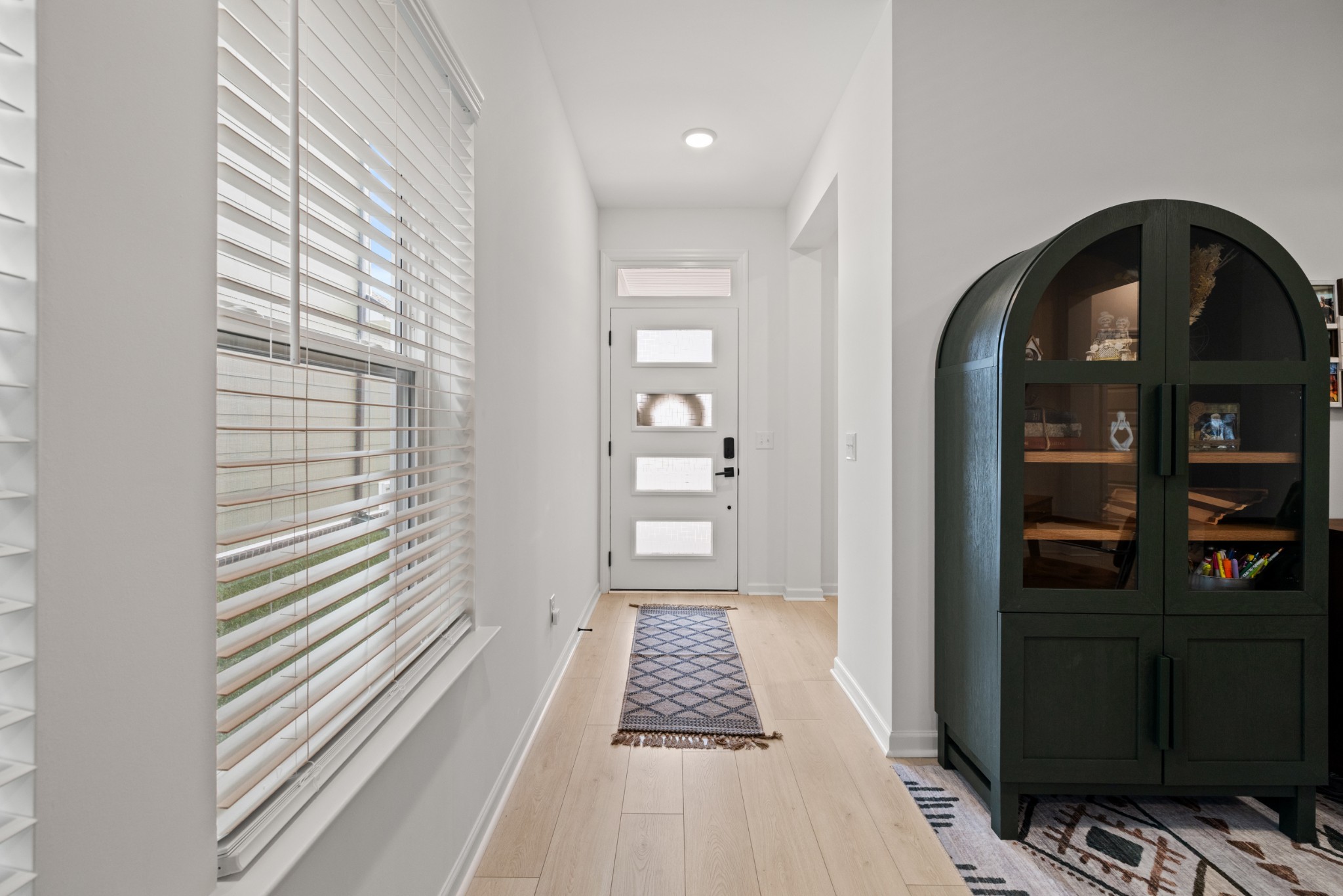 2104 Mackinac Bend Gallatin, TN 37066 - Photo 5 of 23 a view of a hallway with wooden floor and a dining room