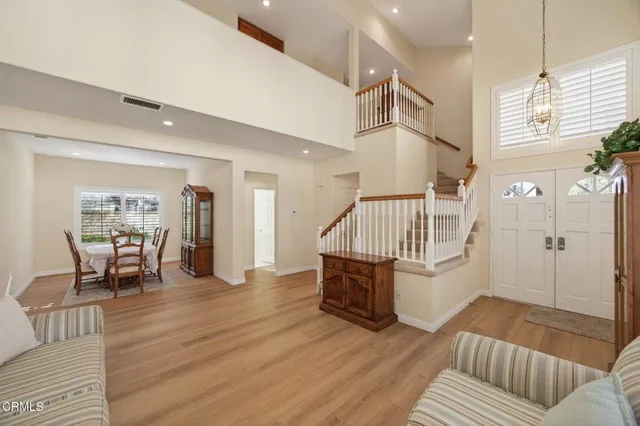 a kitchen with stainless steel appliances a stove sink refrigerator and cabinets