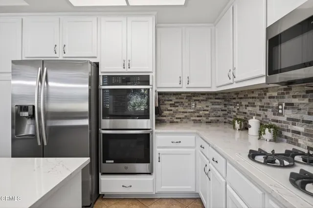 a view of a dining room with furniture and window