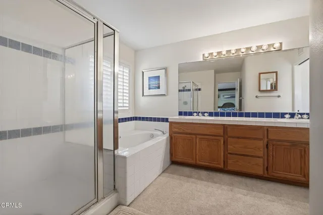 a view of walk in closet with clothes