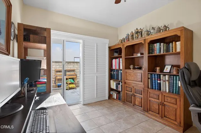 a couple of potted plants in front of door