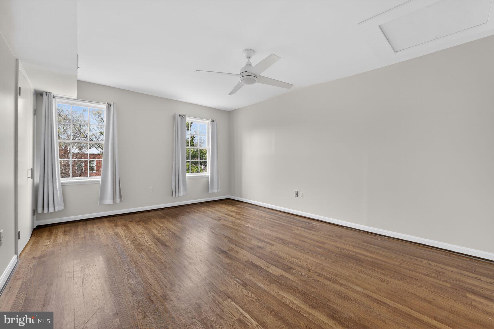 329 1/2 6th Street Southeast, Unit B Washington, DC 20003 - Photo 5 of 13 wooden floor in an empty room with a window
