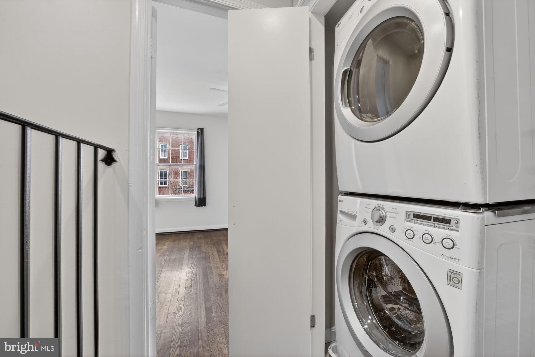 329 1/2 6th Street Southeast, Unit B Washington, DC 20003 - Photo 7 of 13 a view of a hallway with washer and dryer