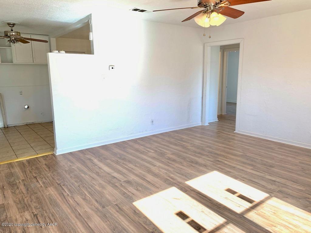 4131 South Harrison Street Amarillo, TX 79110 - Photo 2 of 8 an empty room with wooden floor