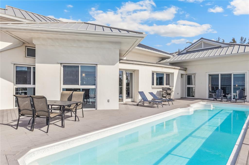 2925 Shore Lane Boca Grande, FL 33921 - Photo 23 of 25 a view of a patio with table and chairs and potted plants