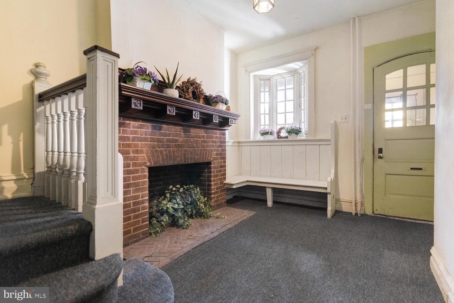 304 Florence Avenue Jenkintown, PA 19046 - Photo 5 of 31 a living room with furniture and a fireplace