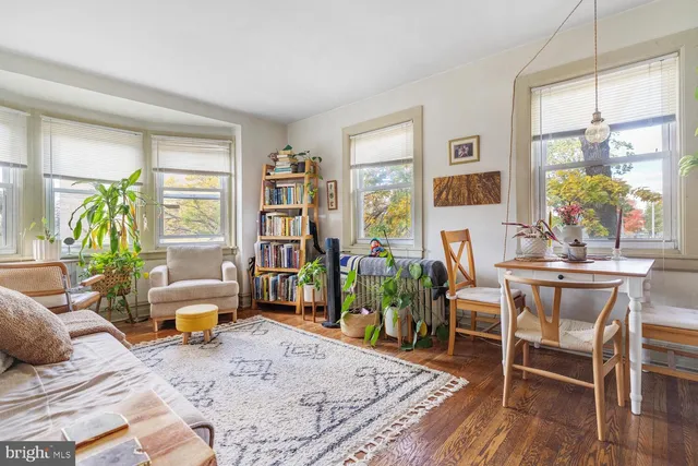 a living room with furniture and a table