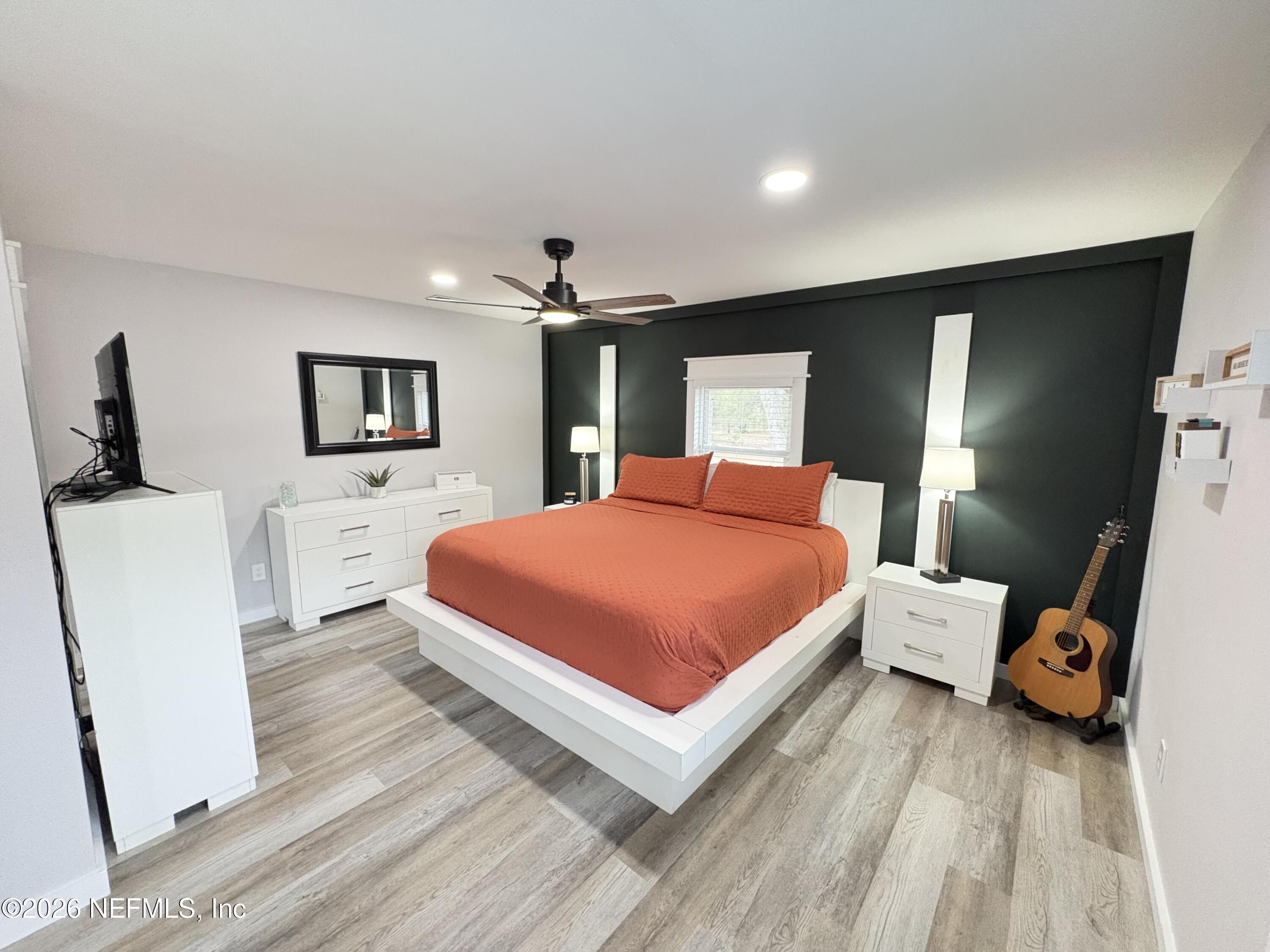 165 Fulton Road Palatka, FL 32177 - Photo 17 of 26 a bedroom with a bed and a large mirror