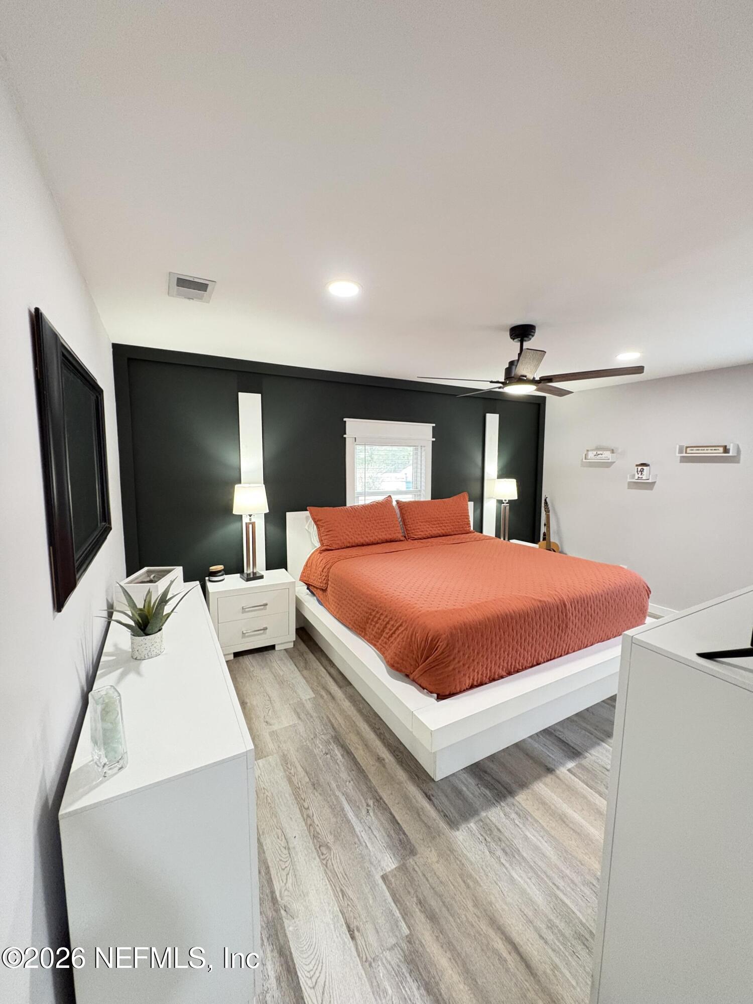 165 Fulton Road Palatka, FL 32177 - Photo 18 of 26 a bed room with a bed and large television