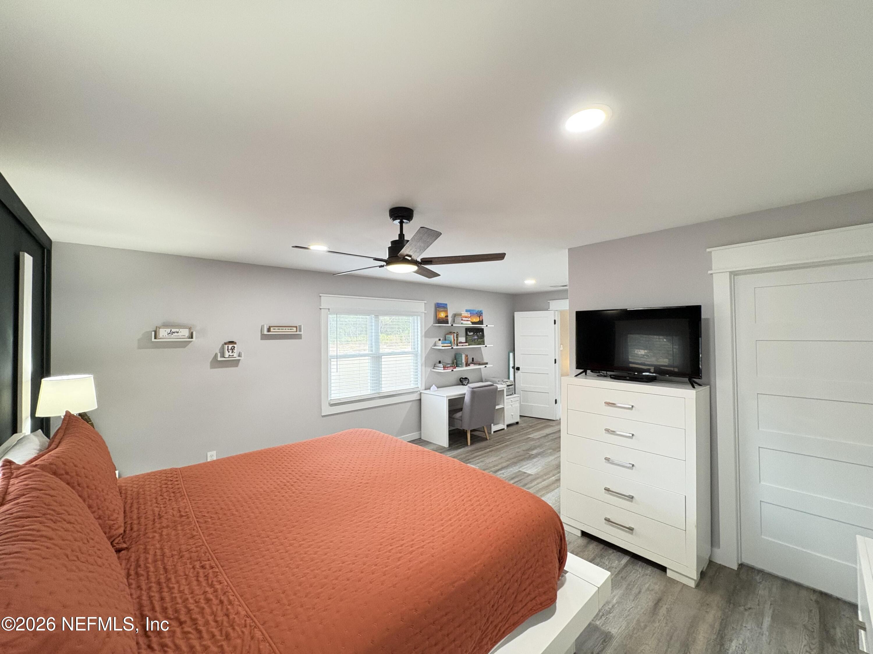 165 Fulton Road Palatka, FL 32177 - Photo 19 of 26 a bedroom with a bed and a flat screen tv